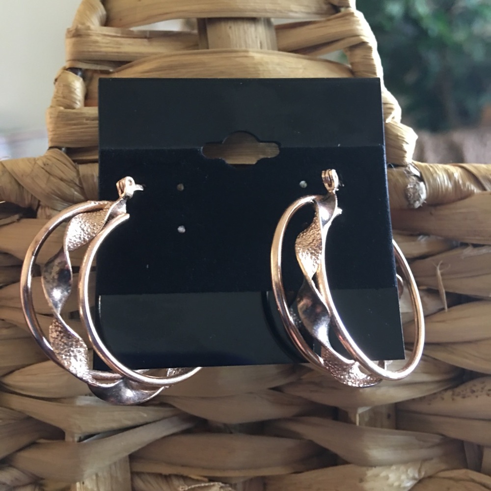 Gold tone twisted hoop pierced earrings